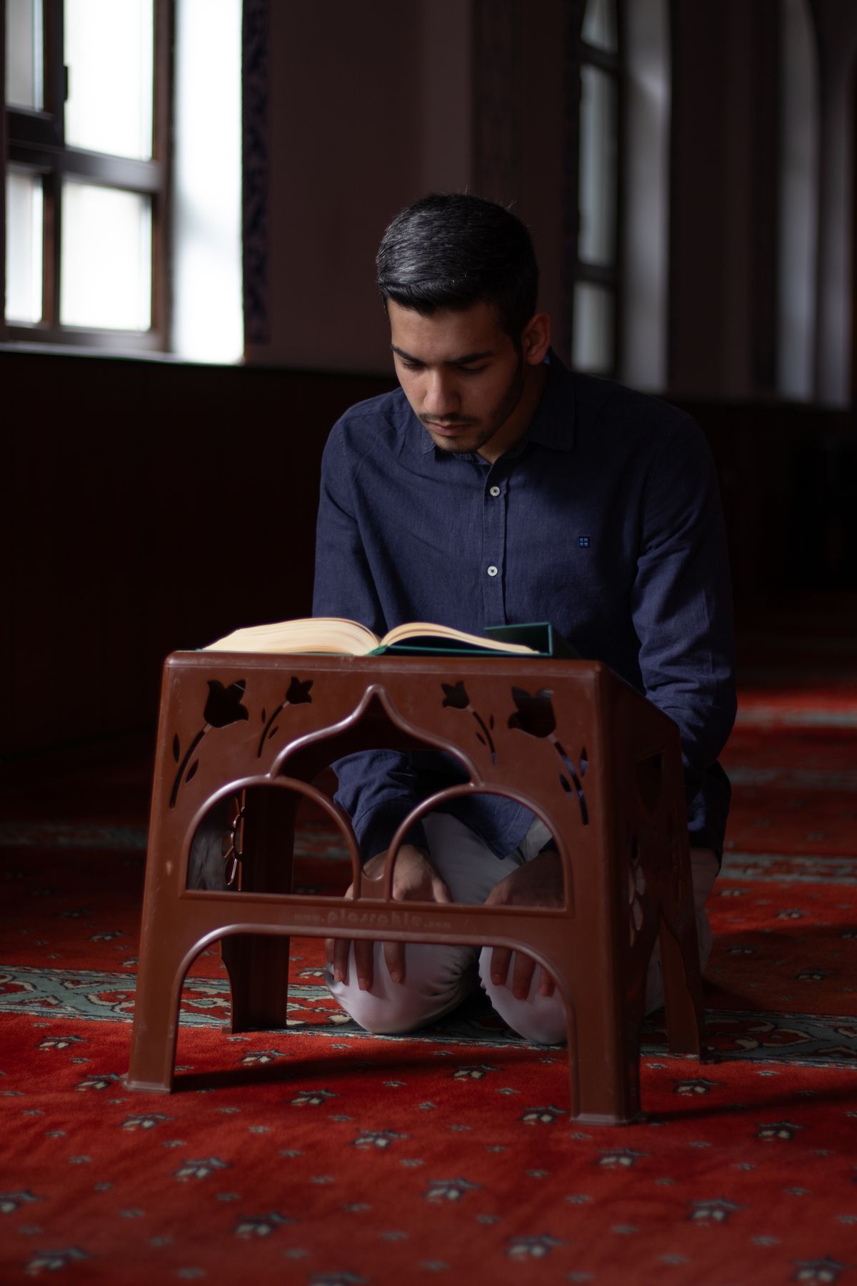 A student reading the Quran